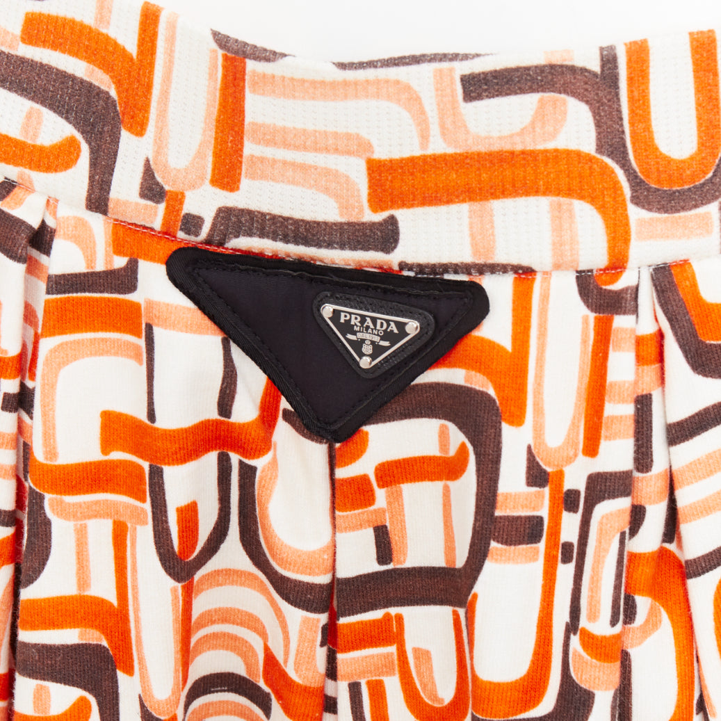 Women's Prada orange geometric link print triangle logo midi skirt