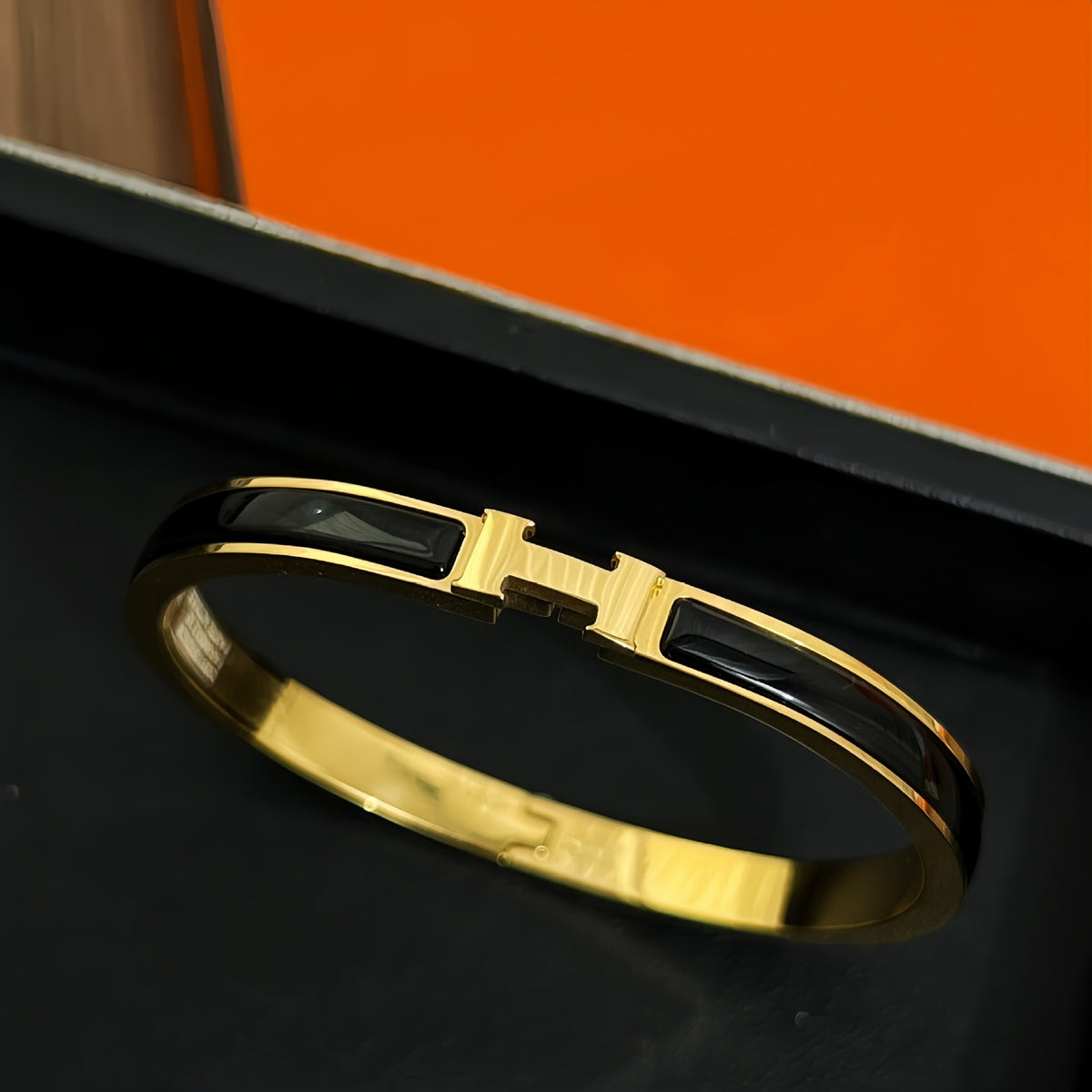 Black accent bangle, gold-tone
