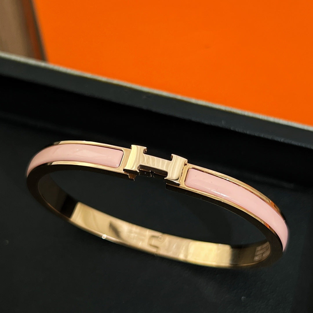 Pink accent bangle, rose-gold-tone