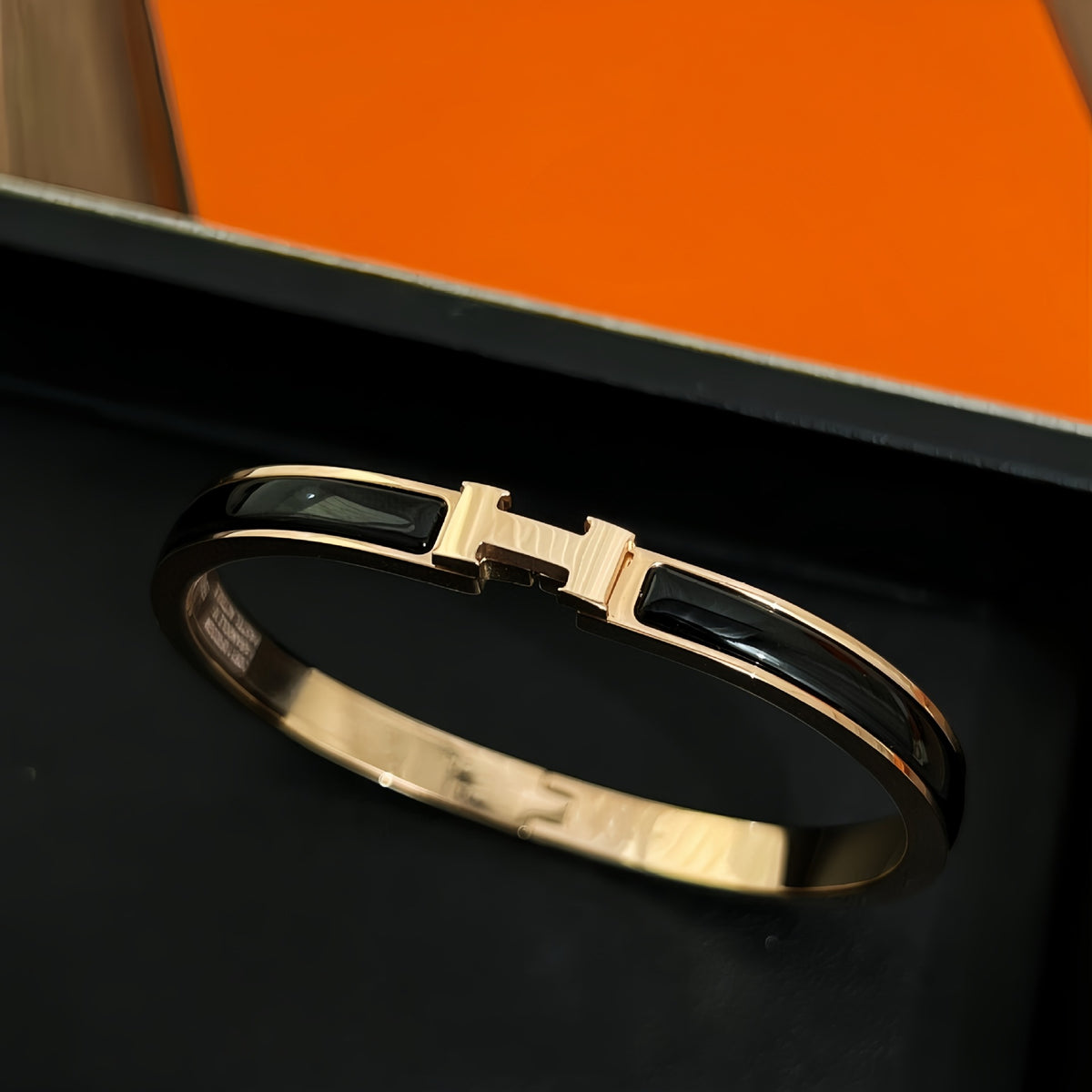 Black accent bangle, rose-gold-tone
