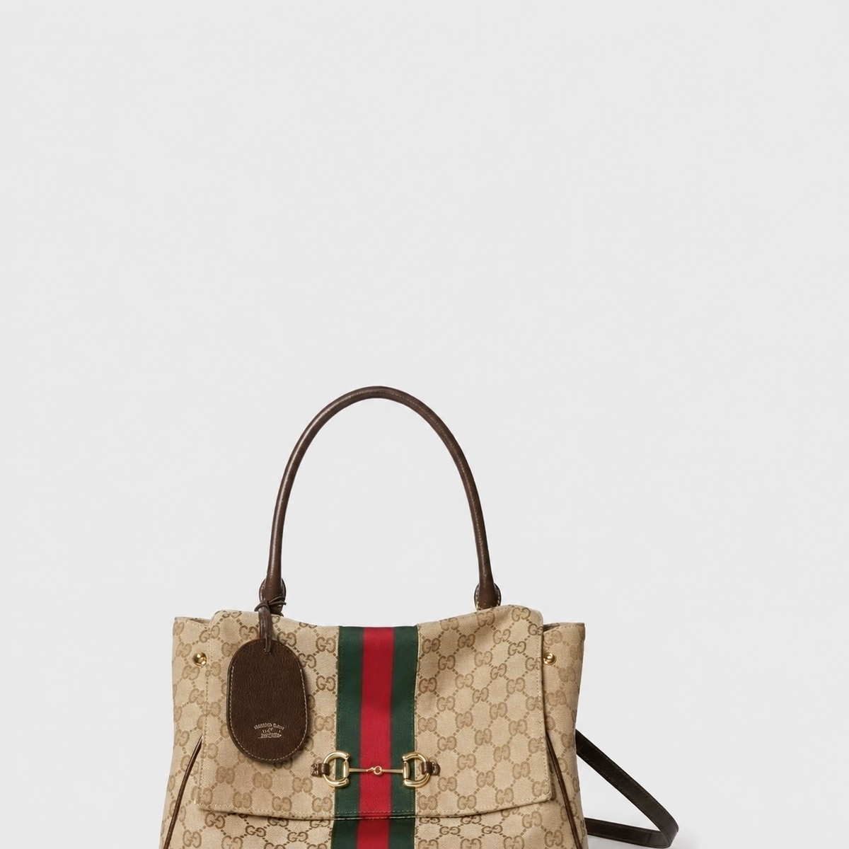 Beige canvas top-handle tote on a light grey background