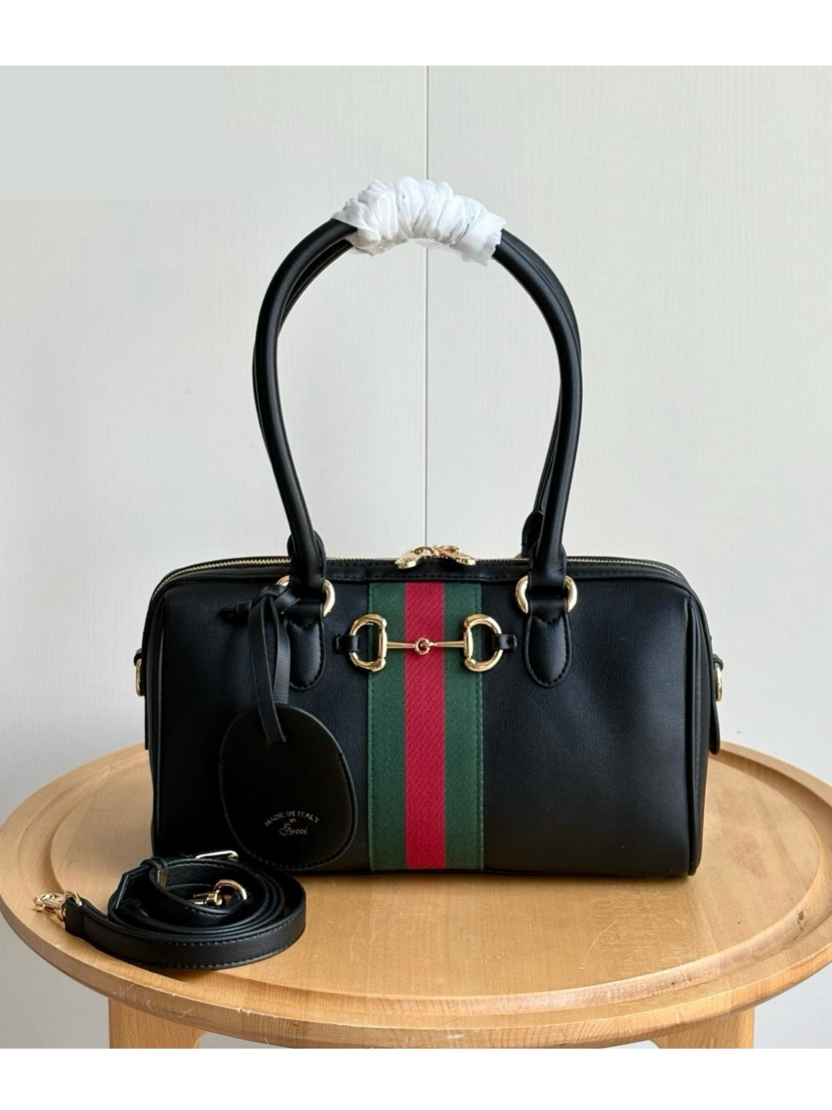 Black barrel satchel with center stripe