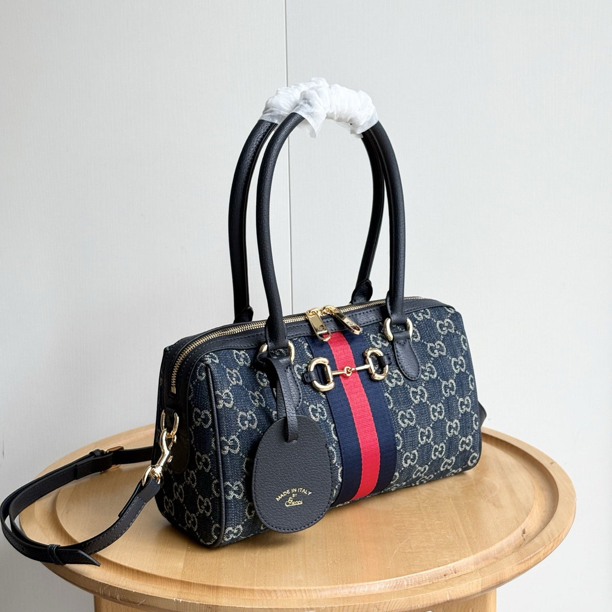 Navy patterned barrel satchel with contrast stripe