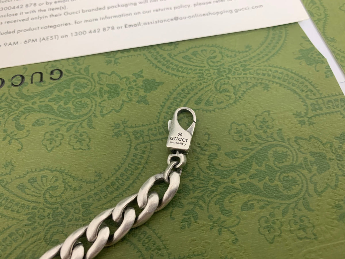 GU Green Enamel Interlock Bracelet