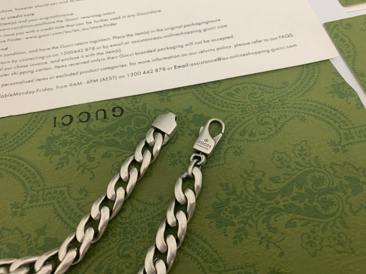 GU Green Enamel Interlock Bracelet
