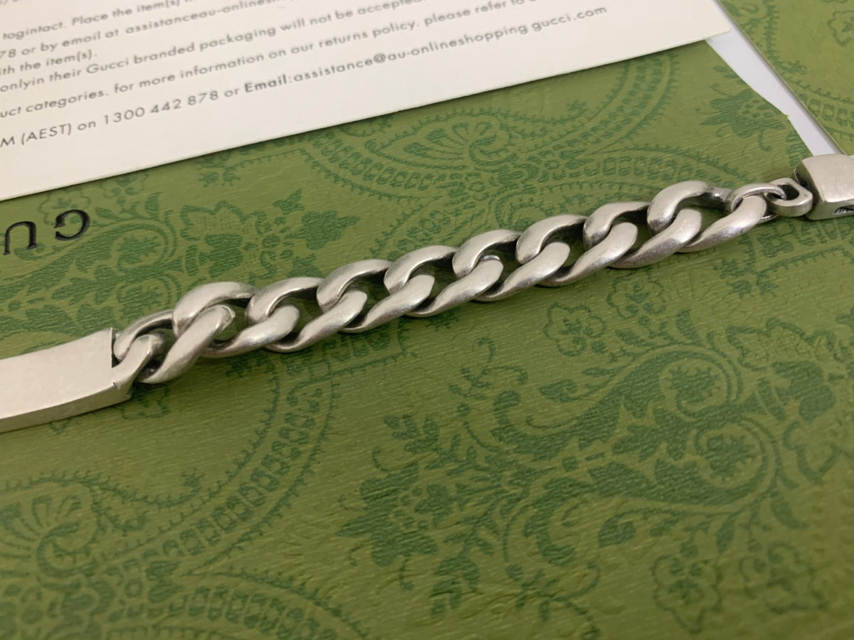 GU Green Enamel Interlock Bracelet