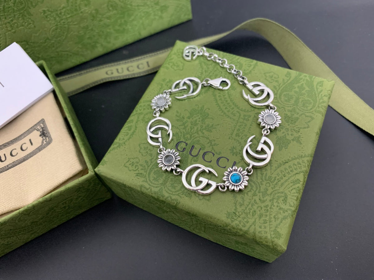 GU Turquoise Tone Floral Bracelet