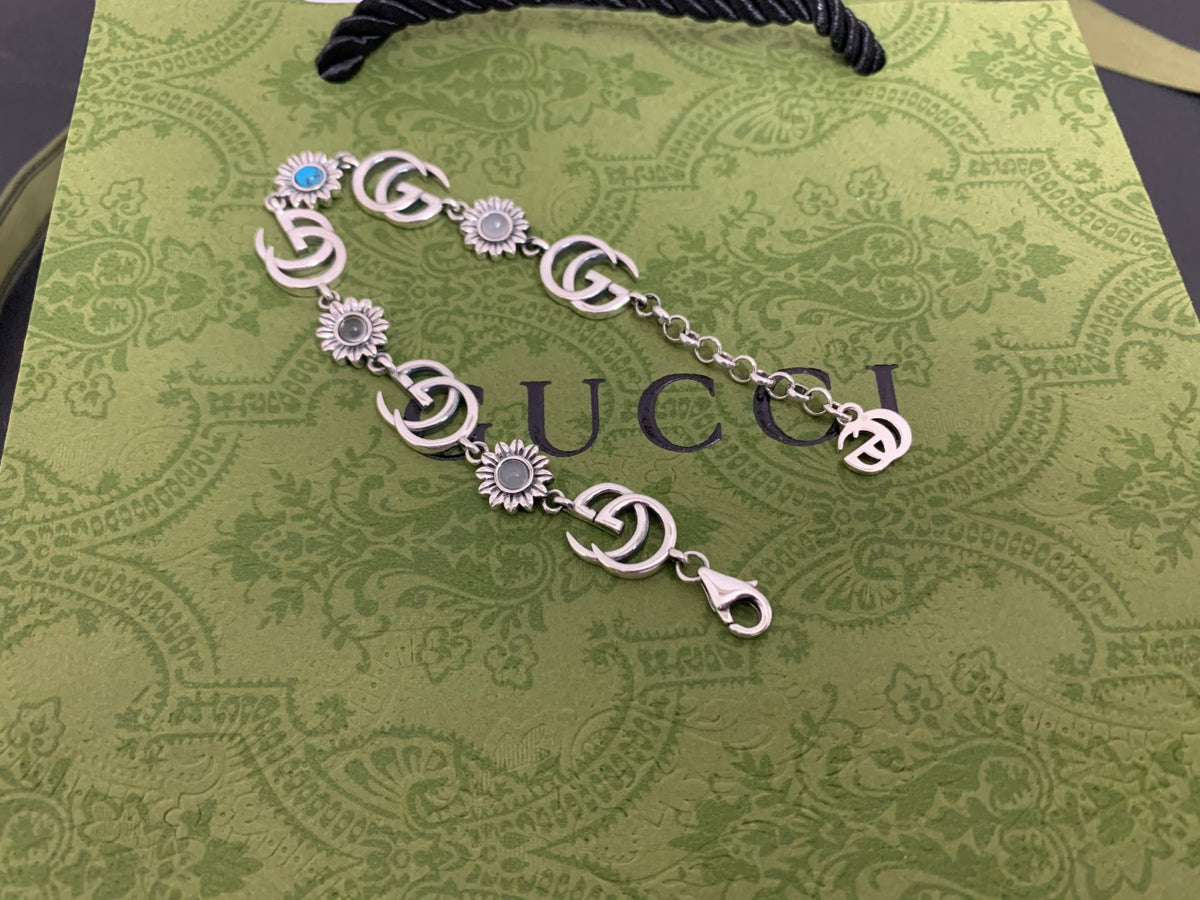 GU Turquoise Tone Floral Bracelet