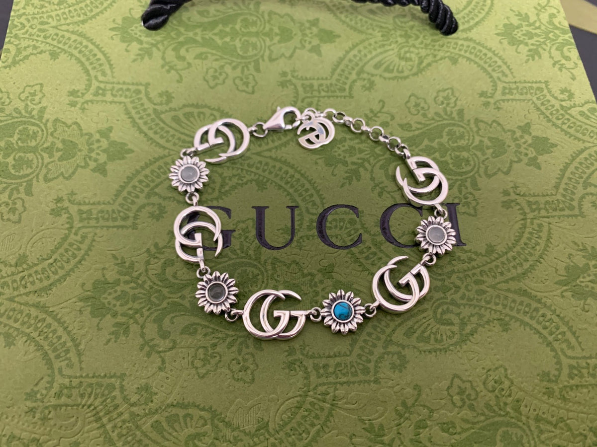 GU Turquoise Tone Floral Bracelet