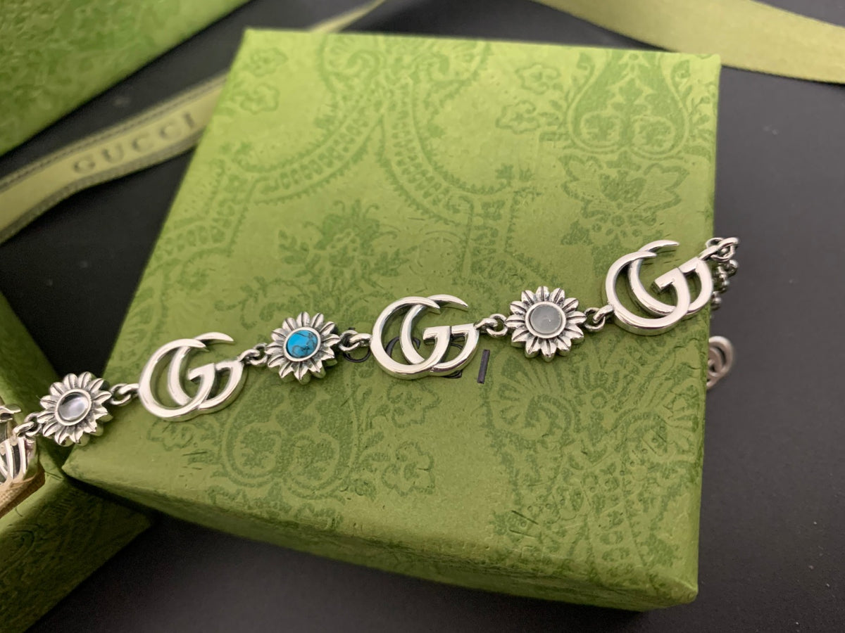 GU Turquoise Tone Floral Bracelet
