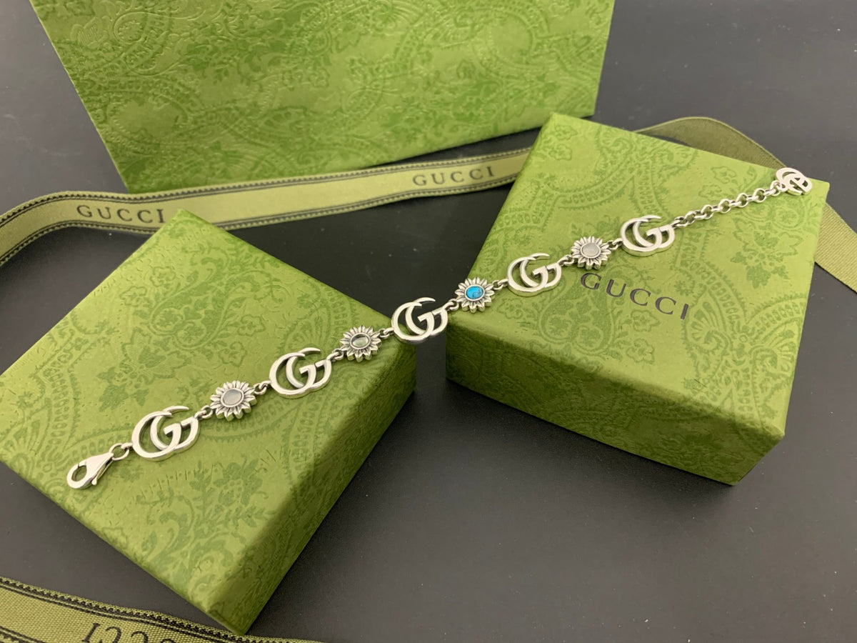 GU Turquoise Tone Floral Bracelet