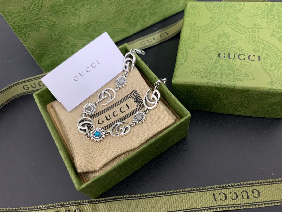 GU Turquoise Tone Floral Bracelet