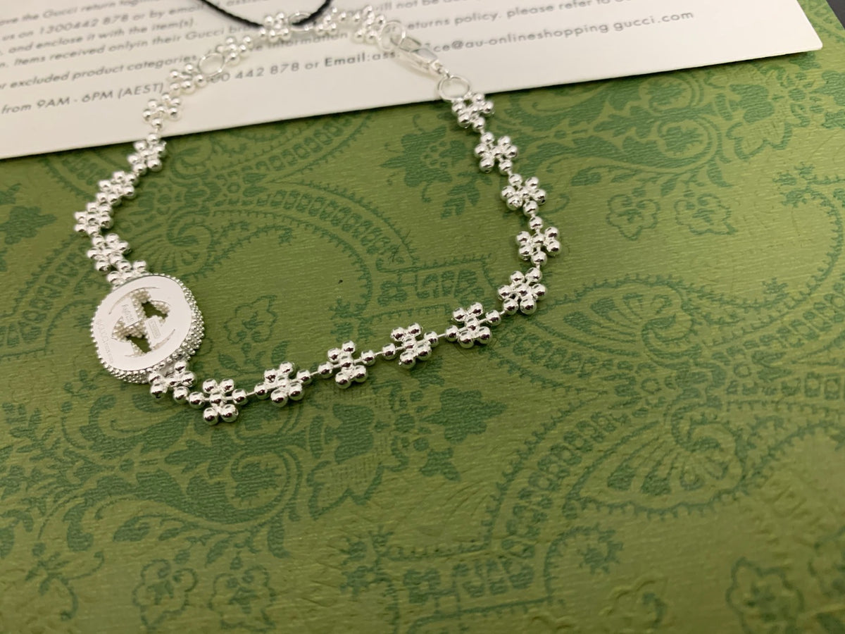 GU Snowflake Charm Bracelet